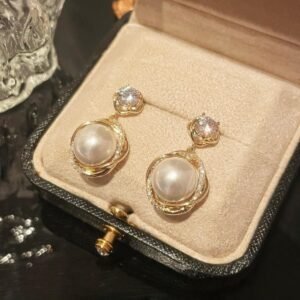 Copper-alloy imitation pearl earrings, micro-inlaid crystal jewelry, luxury drop earrings, gold-toned elegant earrings, hypoallergenic women's earrings, light luxury accessory, versatile pearl earrings, formal event jewelry, everyday elegant wear, affordable luxury earrings, nickel-free fashion jewelry, tarnish-resistant design, gift box included, sophisticated style earrings, modern classic accessory, timeless pearl design, secure clasp earrings, lightweight comfort, women's fashion gift, chic jewelry collection.