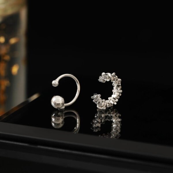 Non-piercing ear cuff, Paris night rain ear jewelry, minimalist copper alloy ear clip, cool-toned silver ear cuff, light luxury ear accessories, adjustable ear cuff, hypoallergenic ear jewelry, architectural ear cuff design, Paris-inspired jewelry, versatile ear cuff, day to night earwear, sensitive ears safe, trendy ear cuff, elegant ear clip, gift for minimalist lovers, silver plated ear cuff, pain-free ear accessory, sophisticated ear jewelry, modern ear cuff design, affordable luxury ear piece.