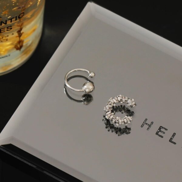 Non-piercing ear cuff, Paris night rain ear jewelry, minimalist copper alloy ear clip, cool-toned silver ear cuff, light luxury ear accessories, adjustable ear cuff, hypoallergenic ear jewelry, architectural ear cuff design, Paris-inspired jewelry, versatile ear cuff, day to night earwear, sensitive ears safe, trendy ear cuff, elegant ear clip, gift for minimalist lovers, silver plated ear cuff, pain-free ear accessory, sophisticated ear jewelry, modern ear cuff design, affordable luxury ear piece.