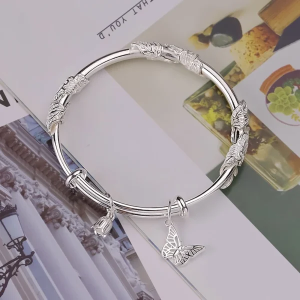 Titanium steel floral butterfly bangle, Chinese style expandable bracelet, 60mm push-pull adjustable jewelry, hypoallergenic engraved bracelet, fade-proof women's accessory, JIN BAI ZHENG brand, symbolic prosperity bracelet, versatile daily wear, sustainable materials, affordable luxury, artisan crafted, positive energy accessory, modern feminine style, special occasion gift, holistic wellness jewelry, cultural inspired design, elegant packaging.