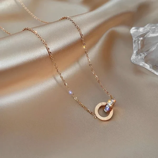 Titanium steel interlocking ring necklace, no-fade lock-neck chain, adjustable 40+5cm jewelry, JIN BAI ZHENG brand, hypoallergenic women's necklace, light luxury collarbone chain, minimalist double-ring pendant, versatile daily wear, symbolic gift idea, sustainable materials, affordable elegance, artisan crafted, positive energy accessory, modern feminine style, special occasion gift, holistic wellness jewelry, cultural inspired design, elegant packaging.