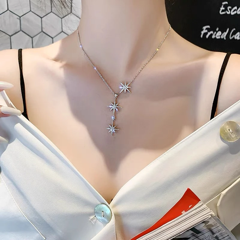 Titanium steel eight-pointed star necklace, snowflake crystal pendant, adjustable tassel collarbone chain, fade-proof women’s jewelry, JIN BAI ZHENG brand, hypoallergenic necklace, light luxury accessory, celestial-inspired design, versatile daily wear, holiday gift idea, sustainable materials, affordable elegance, artisan crafted, positive energy jewelry, modern feminine style, special occasion necklace, winter-themed jewelry, holistic wellness accessory, elegant packaging.