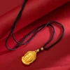 Close-up of Gold Maitreya Buddha Head Pendant with serene expression