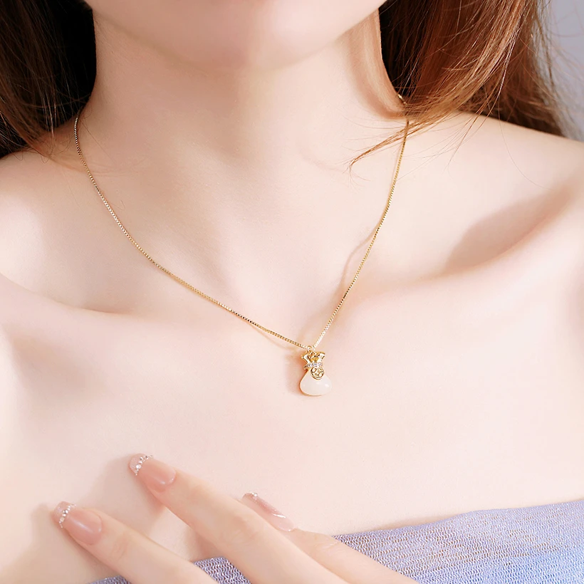 Titanium steel fortune bag necklace, everlasting color jewelry, K-gold plated lock chain, blessing-filled pendant, JIN BAI ZHENG brand, hypoallergenic collarbone necklace, adjustable chain necklace, pearl accent jewelry, light luxury accessory, symbolic gift for her, tarnish-proof necklace, versatile daily wear, cultural inspired design, affordable luxury, sustainable materials, artisan crafted, modern feminine style, positive energy accessory, holistic wellness jewelry, special occasion gift.