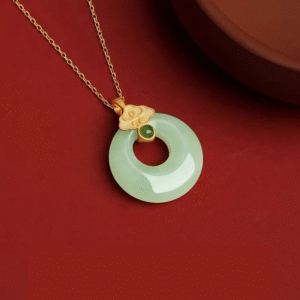 S925 Sterling Silver Lucky Coin Necklace with Light Green Jade on red dish