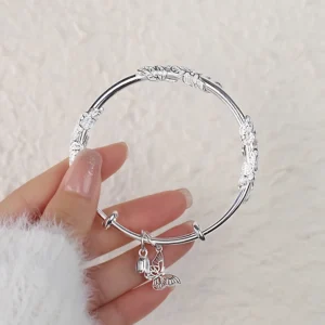 Titanium steel floral butterfly bangle, Chinese style expandable bracelet, 60mm push-pull adjustable jewelry, hypoallergenic engraved bracelet, fade-proof women's accessory, JIN BAI ZHENG brand, symbolic prosperity bracelet, versatile daily wear, sustainable materials, affordable luxury, artisan crafted, positive energy accessory, modern feminine style, special occasion gift, holistic wellness jewelry, cultural inspired design, elegant packaging.