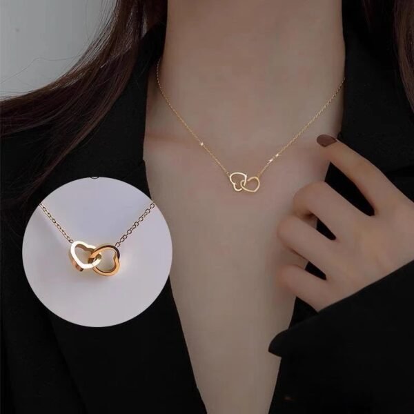 Women wearing JIN BAI ZHENG Interlocking Heart Titanium Steel Necklace with close-up detail