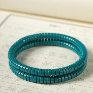 High-porcelain turquoise bracelet, natural turquoise prayer beads, minimalist Buddhist jewelry, 108-bead meditation strand, jade-like turquoise beads, plain turquoise bracelet, spiritual meditation accessory, handmade turquoise beads, calming energy bracelet, sustainable mineral jewelry, Zen meditation beads, unisex spiritual gift, knotting prayer bracelet, ethical turquoise sourcing, luxury minimalist design, mindfulness practice tool, natural stone prayer beads, elegant simplicity bracelet, turquoise healing properties, classic Buddhist accessory.