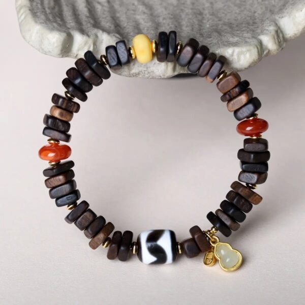 8mm Dalargan agarwood bracelet, 108-bead mala, Buddhist prayer beads, meditation agarwood bracelet, sustainable spiritual jewelry, Dalargan aroma therapy, ethical agarwood sourcing, resin-rich beads, calming fragrance bracelet, minimalist mala design, holistic wellness accessory, traditional knotting technique, grounding energy jewelry, premium prayer beads, gender-neutral spiritual gift, natural grain variations, eco-friendly meditation tool, cultural Buddhist accessory, artisan crafted mala, daily mindfulness bracelet.