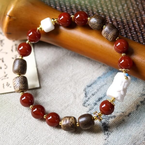 8mm agarwood red agate bracelet, natural Buddhist mala, meditation bead bracelet, spiritual grounding jewelry, agarwood and agate combo, sustainable spiritual accessory, red agate protection bracelet, calming aroma beads, holistic wellness jewelry, handmade mala bracelet, earthy fragrance beads, cultural inspired jewelry, daily mindfulness accessory, elastic-free knotting design, gender-neutral spiritual gift, eco-friendly materials, artisan crafted bracelet, versatile meditation tool, meaningful fashion jewelry, natural grain and pattern variations.