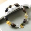 10mm white crystal agarwood bracelet, natural crystal and wood jewelry, purifying energy bracelet, meditation balance accessory, spiritual grounding jewelry, alternating bead design, sustainable spiritual wear, calming aroma beads, holistic healing bracelet, handcrafted mala alternative, positive energy flow jewelry, earthy fragrance beads, daily mindfulness accessory, ethical sourcing bracelet, crystal purification properties, agarwood calming benefits, gender-neutral spiritual gift, eco-friendly materials, artisan crafted bracelet, versatile meditation tool.