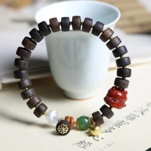Green Qinan agarwood bracelet, tablet bead prayer beads, natural wooden bracelet, meditation aromatherapy beads, sustainable agarwood jewelry, spiritual prayer bracelet, lightweight wood beads, luxury wellness accessory, calming fragrance bracelet, eco-friendly spiritual wear, handmade agarwood beads, minimalist wood jewelry, therapeutic scent bracelet, daily mindfulness beads, organic wood craft, premium Qinan wood, aromatic prayer beads, holistic lifestyle accessory, unique wood grain bracelet, spiritual grounding beads.