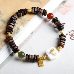7mm Dalargan agarwood bracelet, 108-bead mala, Buddhist prayer beads, meditation agarwood bracelet, sustainable spiritual jewelry, Dalargan aroma therapy, ethical agarwood sourcing, resin-rich beads, calming fragrance bracelet, minimalist mala design, holistic wellness accessory, traditional knotting technique, grounding energy jewelry, premium prayer beads, gender-neutral spiritual gift, natural grain variations, eco-friendly meditation tool, cultural Buddhist accessory, artisan crafted mala, daily mindfulness bracelet.