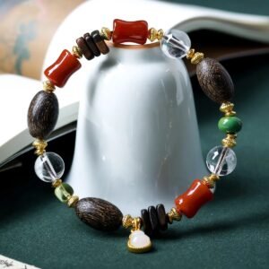 10mm white crystal bracelet, bug-hole agarwood jewelry, natural chénxiāng bracelet, spiritual healing bracelet, red agate and jade accessories, gold-accented beaded bracelet, handmade crystal agarwood combo, meditation energy jewelry, elastic stretch bracelet, white jade heart charm, holistic balance jewelry, Eastern-inspired accessories, aromatic agarwood beads, protection and clarity bracelet, luxury spiritual gift, natural resin-rich agarwood, artisan beaded design, daily mindfulness jewelry, ethical sourcing bracelet, multidimensional beaded bracelet.