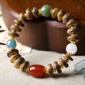 10-11mm Siam agarwood bracelet, Buddhist prayer beads, meditation mala bracelet, natural agarwood jewelry, sustainable spiritual accessory, Siam aroma therapy, ethical agarwood sourcing, resin-rich beads, calming fragrance bracelet, minimalist mala design, holistic wellness accessory, traditional knotting technique, grounding energy jewelry, premium prayer beads, gender-neutral spiritual gift, natural grain variations, eco-friendly meditation tool, cultural Buddhist accessory, artisan crafted mala, daily mindfulness bracelet.