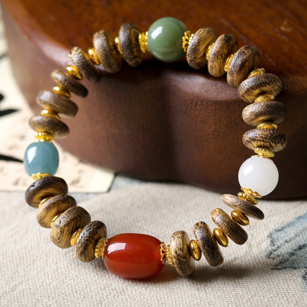 10-11mm Siam agarwood bracelet, Buddhist prayer beads, meditation mala bracelet, natural agarwood jewelry, sustainable spiritual accessory, Siam aroma therapy, ethical agarwood sourcing, resin-rich beads, calming fragrance bracelet, minimalist mala design, holistic wellness accessory, traditional knotting technique, grounding energy jewelry, premium prayer beads, gender-neutral spiritual gift, natural grain variations, eco-friendly meditation tool, cultural Buddhist accessory, artisan crafted mala, daily mindfulness bracelet.