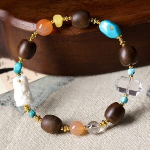 10mm Fushen red soil bracelet, Chinese-style spiritual jewelry, natural earthy beads, turquoise and crystal combo, grounding energy bracelet, cultural gemstone accessory, handmade Chinese design, elastic-free knotting, Fushen aroma therapy, traditional craftsmanship, meditation bracelet, holistic wellness jewelry, ethical material sourcing, gold-toned spacer design, versatile daily wear, symbolic gemstone meanings, artisan crafted mala, eco-friendly jewelry, spiritual gift idea, minimalist elegance, organic texture appeal.Temple consecration, house blessing, feng shui remedies, house pacification ceremonies, monk blessings, protective amulets, peace talismans, safety and peace assurance, wealth-invoking ceremonies, wealth deity statues, wealth-gathering formations, consecrated pi xiu (mythical creature), prayers and blessings, making vows, cultivating merit, peace and safety, imbuing objects with spiritual energy, infusing positive energy through sutra recitation, blessings, chanting mantras and dharani, liberation of deceased spirits, rebirth in the Pure Land, accumulating merit, nurturing compassion, devotional repentance, eliminating karmic obstacles, Buddha, Dharma, Sangha, portable guardian objects, peace-ensuring talismans, warding off evil spirits, neutralizing negative energies, averting disasters, deflecting misfortunes, Taiji and Bagua symbols. Buddhas: Dipamkara Buddha, Shakyamuni Buddha, Maitreya Buddha, Amitabha Buddha, Medicine Buddha, Akshobhya Buddha, Ratnasambhava Buddha, Amoghasiddhi Buddha, Five Dhyani Buddhas, Prabhutaratna Buddha. Bodhisattvas: Avalokiteshvara Bodhisattva, Manjushri Bodhisattva, Samantabhadra Bodhisattva, Ksitigarbha Bodhisattva, Mahasthamaprapta Bodhisattva, Guanyin, Wenshu, Puxian, Dizang, Maitreya, Akashagarbha, Vajrapani, Sarvanivarana-Vishkambhin.