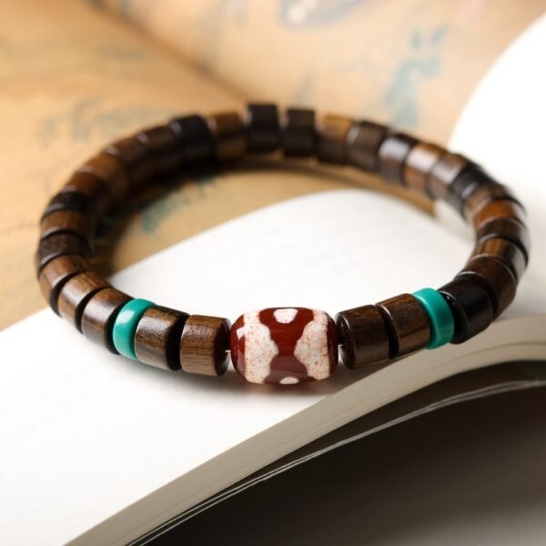 8.5mm sandalwood barrel bead bracelet, red agate turquoise jewelry, Tibetan-inspired spiritual bracelet, natural wood bead bracelet, vintage bohemian accessory, handmade cultural jewelry, elastic-free knotting design, grounding sandalwood aroma, protective gemstone bracelet, unisex spiritual gift, ethical material sourcing, layered bracelet design, minimalist ethnic jewelry, meditation bracelet, artisan crafted mala, organic texture appeal, eco-friendly materials, symbolic gemstone meanings, versatile daily wear, holistic wellness accessory.Temple consecration, house blessing, feng shui remedies, house pacification ceremonies, monk blessings, protective amulets, peace talismans, safety and peace assurance, wealth-invoking ceremonies, wealth deity statues, wealth-gathering formations, consecrated pi xiu (mythical creature), prayers and blessings, making vows, cultivating merit, peace and safety, imbuing objects with spiritual energy, infusing positive energy through sutra recitation, blessings, chanting mantras and dharani, liberation of deceased spirits, rebirth in the Pure Land, accumulating merit, nurturing compassion, devotional repentance, eliminating karmic obstacles, Buddha, Dharma, Sangha, portable guardian objects, peace-ensuring talismans, warding off evil spirits, neutralizing negative energies, averting disasters, deflecting misfortunes, Taiji and Bagua symbols. Buddhas: Dipamkara Buddha, Shakyamuni Buddha, Maitreya Buddha, Amitabha Buddha, Medicine Buddha, Akshobhya Buddha, Ratnasambhava Buddha, Amoghasiddhi Buddha, Five Dhyani Buddhas, Prabhutaratna Buddha. Bodhisattvas: Avalokiteshvara Bodhisattva, Manjushri Bodhisattva, Samantabhadra Bodhisattva, Ksitigarbha Bodhisattva, Mahasthamaprapta Bodhisattva, Guanyin, Wenshu, Puxian, Dizang, Maitreya, Akashagarbha, Vajrapani, Sarvanivarana-Vishkambhin.