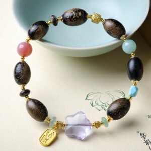 Ant-infested agarwood bracelet, 10-12mm resin wood beads, natural aromatic jewelry, gemstone-accented bracelet, purple crystal flower charm, gold-plated pendant design, earthy fragrance beads, spiritual grounding accessory, bohemian style jewelry, handmade unique bracelet, ethical agarwood sourcing, elastic-free knotting, organic texture appeal, meditation aromatherapy, cultural symbolic jewelry, versatile layering piece, artisan crafted mala, eco-friendly materials, gift for nature lovers, holistic wellness accessory.Temple consecration, house blessing, feng shui remedies, house pacification ceremonies, monk blessings, protective amulets, peace talismans, safety and peace assurance, wealth-invoking ceremonies, wealth deity statues, wealth-gathering formations, consecrated pi xiu (mythical creature), prayers and blessings, making vows, cultivating merit, peace and safety, imbuing objects with spiritual energy, infusing positive energy through sutra recitation, blessings, chanting mantras and dharani, liberation of deceased spirits, rebirth in the Pure Land, accumulating merit, nurturing compassion, devotional repentance, eliminating karmic obstacles, Buddha, Dharma, Sangha, portable guardian objects, peace-ensuring talismans, warding off evil spirits, neutralizing negative energies, averting disasters, deflecting misfortunes, Taiji and Bagua symbols. Buddhas: Dipamkara Buddha, Shakyamuni Buddha, Maitreya Buddha, Amitabha Buddha, Medicine Buddha, Akshobhya Buddha, Ratnasambhava Buddha, Amoghasiddhi Buddha, Five Dhyani Buddhas, Prabhutaratna Buddha. Bodhisattvas: Avalokiteshvara Bodhisattva, Manjushri Bodhisattva, Samantabhadra Bodhisattva, Ksitigarbha Bodhisattva, Mahasthamaprapta Bodhisattva, Guanyin, Wenshu, Puxian, Dizang, Maitreya, Akashagarbha, Vajrapani, Sarvanivarana-Vishkambhin.