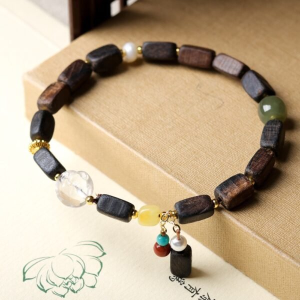 Dalan agarwood bracelet, 6-9mm wood beads, gemstone charm jewelry, natural aromatic bracelet, handmade spiritual accessory, bohemian layered bracelet, crystal jade amber combo, elastic-free knotting design, earthy fragrance beads, ethical agarwood sourcing, cultural symbolic jewelry, meditation grounding bracelet, holistic wellness gift, unisex spiritual wear, organic texture appeal, artisan crafted mala, versatile daily accessory, eco-friendly materials, minimalist elegance, positive energy jewelry.Temple consecration, house blessing, feng shui remedies, house pacification ceremonies, monk blessings, protective amulets, peace talismans, safety and peace assurance, wealth-invoking ceremonies, wealth deity statues, wealth-gathering formations, consecrated pi xiu (mythical creature), prayers and blessings, making vows, cultivating merit, peace and safety, imbuing objects with spiritual energy, infusing positive energy through sutra recitation, blessings, chanting mantras and dharani, liberation of deceased spirits, rebirth in the Pure Land, accumulating merit, nurturing compassion, devotional repentance, eliminating karmic obstacles, Buddha, Dharma, Sangha, portable guardian objects, peace-ensuring talismans, warding off evil spirits, neutralizing negative energies, averting disasters, deflecting misfortunes, Taiji and Bagua symbols. Buddhas: Dipamkara Buddha, Shakyamuni Buddha, Maitreya Buddha, Amitabha Buddha, Medicine Buddha, Akshobhya Buddha, Ratnasambhava Buddha, Amoghasiddhi Buddha, Five Dhyani Buddhas, Prabhutaratna Buddha. Bodhisattvas: Avalokiteshvara Bodhisattva, Manjushri Bodhisattva, Samantabhadra Bodhisattva, Ksitigarbha Bodhisattva, Mahasthamaprapta Bodhisattva, Guanyin, Wenshu, Puxian, Dizang, Maitreya, Akashagarbha, Vajrapani, Sarvanivarana-Vishkambhin.