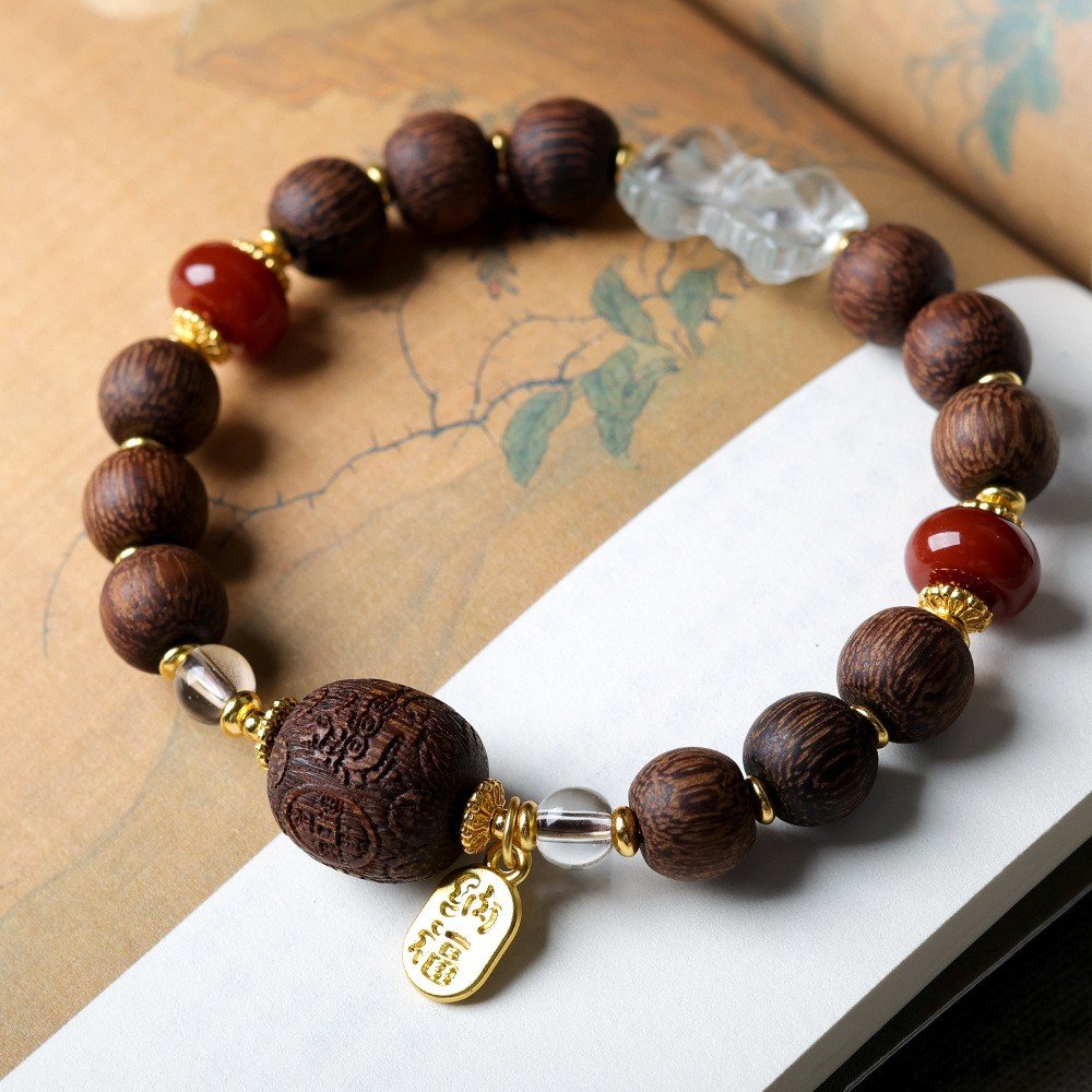 8-9mm sugar-clean agarwood bracelet, fortune blessing mala, crystal carnelian beads, Chinese character charm, pale agarwood jewelry, spiritual elegance bracelet, handmade cultural accessory, aromatic wellness bracelet, ethical agarwood sourcing, gold-toned charm design, holistic healing jewelry, minimalist spiritual gift, elastic-free knotting, daily mindfulness accessory, symbolic prosperity bracelet, natural sweet fragrance, artisan crafted mala, versatile layering piece, eco-friendly materials, positive energy jewelry.Temple consecration, house blessing, feng shui remedies, house pacification ceremonies, monk blessings, protective amulets, peace talismans, safety and peace assurance, wealth-invoking ceremonies, wealth deity statues, wealth-gathering formations, consecrated pi xiu (mythical creature), prayers and blessings, making vows, cultivating merit, peace and safety, imbuing objects with spiritual energy, infusing positive energy through sutra recitation, blessings, chanting mantras and dharani, liberation of deceased spirits, rebirth in the Pure Land, accumulating merit, nurturing compassion, devotional repentance, eliminating karmic obstacles, Buddha, Dharma, Sangha, portable guardian objects, peace-ensuring talismans, warding off evil spirits, neutralizing negative energies, averting disasters, deflecting misfortunes, Taiji and Bagua symbols. Buddhas: Dipamkara Buddha, Shakyamuni Buddha, Maitreya Buddha, Amitabha Buddha, Medicine Buddha, Akshobhya Buddha, Ratnasambhava Buddha, Amoghasiddhi Buddha, Five Dhyani Buddhas, Prabhutaratna Buddha. Bodhisattvas: Avalokiteshvara Bodhisattva, Manjushri Bodhisattva, Samantabhadra Bodhisattva, Ksitigarbha Bodhisattva, Mahasthamaprapta Bodhisattva, Guanyin, Wenshu, Puxian, Dizang, Maitreya, Akashagarbha, Vajrapani, Sarvanivarana-Vishkambhin.