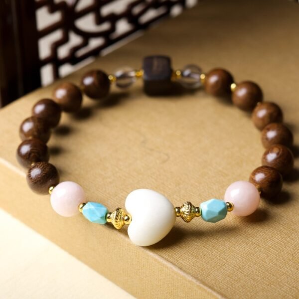 8mm Goldthread Nanmu bracelet, handmade wooden prayer beads, meditation mala bracelet, sustainable wood jewelry, spiritual grounding accessory, natural grain bracelet, minimalist spiritual wear, elastic-free knotting design, eco-friendly materials, cultural inspired jewelry, daily mindfulness accessory, lightweight wood beads, earthy fragrance bracelet, holistic wellness gift, artisan crafted mala, traditional craftsmanship, Zen style bracelet, organic texture appeal, gender-neutral spiritual jewelry, calming energy accessory.Temple consecration, house blessing, feng shui remedies, house pacification ceremonies, monk blessings, protective amulets, peace talismans, safety and peace assurance, wealth-invoking ceremonies, wealth deity statues, wealth-gathering formations, consecrated pi xiu (mythical creature), prayers and blessings, making vows, cultivating merit, peace and safety, imbuing objects with spiritual energy, infusing positive energy through sutra recitation, blessings, chanting mantras and dharani, liberation of deceased spirits, rebirth in the Pure Land, accumulating merit, nurturing compassion, devotional repentance, eliminating karmic obstacles, Buddha, Dharma, Sangha, portable guardian objects, peace-ensuring talismans, warding off evil spirits, neutralizing negative energies, averting disasters, deflecting misfortunes, Taiji and Bagua symbols. Buddhas: Dipamkara Buddha, Shakyamuni Buddha, Maitreya Buddha, Amitabha Buddha, Medicine Buddha, Akshobhya Buddha, Ratnasambhava Buddha, Amoghasiddhi Buddha, Five Dhyani Buddhas, Prabhutaratna Buddha. Bodhisattvas: Avalokiteshvara Bodhisattva, Manjushri Bodhisattva, Samantabhadra Bodhisattva, Ksitigarbha Bodhisattva, Mahasthamaprapta Bodhisattva, Guanyin, Wenshu, Puxian, Dizang, Maitreya, Akashagarbha, Vajrapani, Sarvanivarana-Vishkambhin.