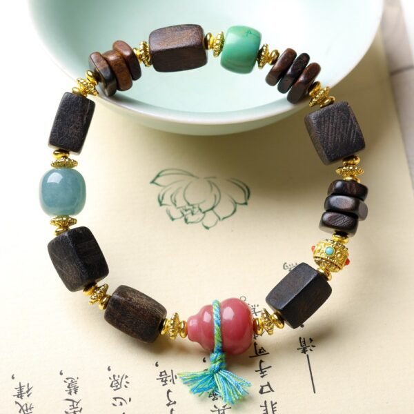 8mm Dalargan agarwood bracelet, gourd pendant bracelet, turquoise coral beads, handmade Buddhist mala, meditation prayer beads, spiritual grounding jewelry, Tibetan inspired accessory, natural gemstone bracelet, elastic-free knotting, cultural symbolism jewelry, agarwood aroma therapy, ethical sourcing bracelet, daily mindfulness accessory, holistic wellness gift, artisan crafted mala, versatile layering piece, eco-friendly materials, positive energy jewelry, traditional craftsmanship, unique spiritual gift.Temple consecration, house blessing, feng shui remedies, house pacification ceremonies, monk blessings, protective amulets, peace talismans, safety and peace assurance, wealth-invoking ceremonies, wealth deity statues, wealth-gathering formations, consecrated pi xiu (mythical creature), prayers and blessings, making vows, cultivating merit, peace and safety, imbuing objects with spiritual energy, infusing positive energy through sutra recitation, blessings, chanting mantras and dharani, liberation of deceased spirits, rebirth in the Pure Land, accumulating merit, nurturing compassion, devotional repentance, eliminating karmic obstacles, Buddha, Dharma, Sangha, portable guardian objects, peace-ensuring talismans, warding off evil spirits, neutralizing negative energies, averting disasters, deflecting misfortunes, Taiji and Bagua symbols. Buddhas: Dipamkara Buddha, Shakyamuni Buddha, Maitreya Buddha, Amitabha Buddha, Medicine Buddha, Akshobhya Buddha, Ratnasambhava Buddha, Amoghasiddhi Buddha, Five Dhyani Buddhas, Prabhutaratna Buddha. Bodhisattvas: Avalokiteshvara Bodhisattva, Manjushri Bodhisattva, Samantabhadra Bodhisattva, Ksitigarbha Bodhisattva, Mahasthamaprapta Bodhisattva, Guanyin, Wenshu, Puxian, Dizang, Maitreya, Akashagarbha, Vajrapani, Sarvanivarana-Vishkambhin.