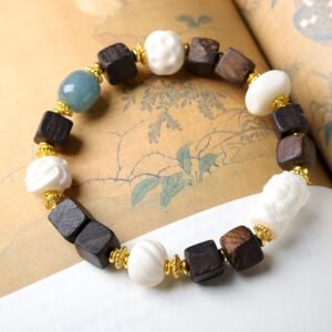 10mm Dalargan agarwood bracelet, square bead jewelry, carved Bodhi beads, elastic cord spiritual bracelet, vintage-style accessory, teal gemstone accents, gold filigree spacers, handmade meditation beads, ethical agarwood sourcing, cultural symbolism jewelry, natural aroma therapy, minimalist elegance, holistic wellness gift, artisan crafted mala, versatile daily wear, eco-friendly materials, spiritual grounding accessory, botanical inspiration, unique texture design, gift for mindfulness.Temple consecration, house blessing, feng shui remedies, house pacification ceremonies, monk blessings, protective amulets, peace talismans, safety and peace assurance, wealth-invoking ceremonies, wealth deity statues, wealth-gathering formations, consecrated pi xiu (mythical creature), prayers and blessings, making vows, cultivating merit, peace and safety, imbuing objects with spiritual energy, infusing positive energy through sutra recitation, blessings, chanting mantras and dharani, liberation of deceased spirits, rebirth in the Pure Land, accumulating merit, nurturing compassion, devotional repentance, eliminating karmic obstacles, Buddha, Dharma, Sangha, portable guardian objects, peace-ensuring talismans, warding off evil spirits, neutralizing negative energies, averting disasters, deflecting misfortunes, Taiji and Bagua symbols. Buddhas: Dipamkara Buddha, Shakyamuni Buddha, Maitreya Buddha, Amitabha Buddha, Medicine Buddha, Akshobhya Buddha, Ratnasambhava Buddha, Amoghasiddhi Buddha, Five Dhyani Buddhas, Prabhutaratna Buddha. Bodhisattvas: Avalokiteshvara Bodhisattva, Manjushri Bodhisattva, Samantabhadra Bodhisattva, Ksitigarbha Bodhisattva, Mahasthamaprapta Bodhisattva, Guanyin, Wenshu, Puxian, Dizang, Maitreya, Akashagarbha, Vajrapani, Sarvanivarana-Vishkambhin.
