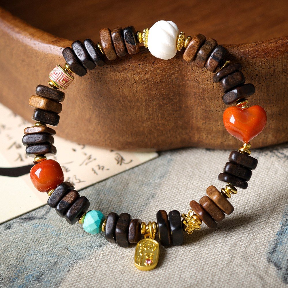 8mm Dalargan agarwood bracelet, turquoise and coral heart jewelry, gold-accented spiritual bracelet, meditation prayer beads, handmade cultural accessory, ethical agarwood sourcing, elastic-free knotting design, natural aroma therapy, symbolic lotus charm, bohemian elegance, holistic wellness gift, versatile layering piece, artisan crafted mala, eco-friendly materials, daily mindfulness jewelry, grounding energy accessory, unique gift idea, luxury spiritual wear, positive energy jewelry, cultural symbolism.Temple consecration, house blessing, feng shui remedies, house pacification ceremonies, monk blessings, protective amulets, peace talismans, safety and peace assurance, wealth-invoking ceremonies, wealth deity statues, wealth-gathering formations, consecrated pi xiu (mythical creature), prayers and blessings, making vows, cultivating merit, peace and safety, imbuing objects with spiritual energy, infusing positive energy through sutra recitation, blessings, chanting mantras and dharani, liberation of deceased spirits, rebirth in the Pure Land, accumulating merit, nurturing compassion, devotional repentance, eliminating karmic obstacles, Buddha, Dharma, Sangha, portable guardian objects, peace-ensuring talismans, warding off evil spirits, neutralizing negative energies, averting disasters, deflecting misfortunes, Taiji and Bagua symbols. Buddhas: Dipamkara Buddha, Shakyamuni Buddha, Maitreya Buddha, Amitabha Buddha, Medicine Buddha, Akshobhya Buddha, Ratnasambhava Buddha, Amoghasiddhi Buddha, Five Dhyani Buddhas, Prabhutaratna Buddha. Bodhisattvas: Avalokiteshvara Bodhisattva, Manjushri Bodhisattva, Samantabhadra Bodhisattva, Ksitigarbha Bodhisattva, Mahasthamaprapta Bodhisattva, Guanyin, Wenshu, Puxian, Dizang, Maitreya, Akashagarbha, Vajrapani, Sarvanivarana-Vishkambhin. 