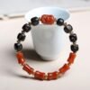 8mm bug-leak Nanhong bracelet, bamboo-joint agate beads, red and black contrast jewelry, natural Nanhong agate bracelet, spiritual elegance accessory, unique cultural bracelet, handmade agate jewelry, daily wear spiritual beads, symbolic resilience bracelet, artistic bamboo design, eco-friendly jewelry, minimalist agate bracelet, gift for spiritual seekers, traditional inspired accessory, balanced energy jewelry, natural texture beads, versatile agate bracelet, ethical sourcing jewelry, mindful living accessory, cultural art bracelet.