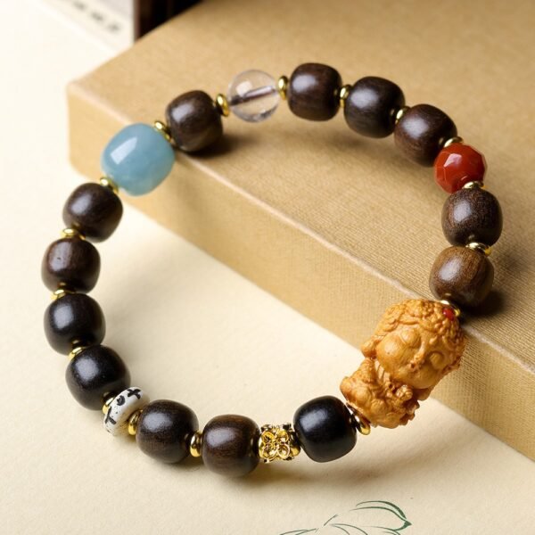 8-9mm medicinal agarwood bracelet, Buddha head prayer beads, handcrafted gemstone bracelet, spiritual protection jewelry, Buddhist meditation accessory, natural agarwood aroma therapy, ethical sourcing bracelet, cultural symbolism jewelry, elastic-free knotting design, holistic wellness gift, minimalist spiritual wear, artisan crafted mala, versatile daily bracelet, grounding energy accessory, meaningful gift idea, eco-friendly materials, traditional Buddhist design, luxury mindfulness jewelry, positive energy beads, serene elegance accessory.Temple consecration, house blessing, feng shui remedies, house pacification ceremonies, monk blessings, protective amulets, peace talismans, safety and peace assurance, wealth-invoking ceremonies, wealth deity statues, wealth-gathering formations, consecrated pi xiu (mythical creature), prayers and blessings, making vows, cultivating merit, peace and safety, imbuing objects with spiritual energy, infusing positive energy through sutra recitation, blessings, chanting mantras and dharani, liberation of deceased spirits, rebirth in the Pure Land, accumulating merit, nurturing compassion, devotional repentance, eliminating karmic obstacles, Buddha, Dharma, Sangha, portable guardian objects, peace-ensuring talismans, warding off evil spirits, neutralizing negative energies, averting disasters, deflecting misfortunes, Taiji and Bagua symbols. Buddhas: Dipamkara Buddha, Shakyamuni Buddha, Maitreya Buddha, Amitabha Buddha, Medicine Buddha, Akshobhya Buddha, Ratnasambhava Buddha, Amoghasiddhi Buddha, Five Dhyani Buddhas, Prabhutaratna Buddha. Bodhisattvas: Avalokiteshvara Bodhisattva, Manjushri Bodhisattva, Samantabhadra Bodhisattva, Ksitigarbha Bodhisattva, Mahasthamaprapta Bodhisattva, Guanyin, Wenshu, Puxian, Dizang, Maitreya, Akashagarbha, Vajrapani, Sarvanivarana-Vishkambhin.