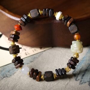 8mm Dalan bracelet, wooden beaded bracelet, gemstone accent jewelry, jade charm bracelet, natural spiritual jewelry, handmade meditation beads, ethical sourcing, earthy aroma therapy, gold-toned spacers, cultural symbolism, bohemian style accessory, elastic-free knotting, daily mindfulness bracelet, holistic wellness gift, unique gift idea, artisan crafted, versatile layering piece, eco-friendly materials, positive energy jewelry, grounding accessory.Temple consecration, house blessing, feng shui remedies, house pacification ceremonies, monk blessings, protective amulets, peace talismans, safety and peace assurance, wealth-invoking ceremonies, wealth deity statues, wealth-gathering formations, consecrated pi xiu (mythical creature), prayers and blessings, making vows, cultivating merit, peace and safety, imbuing objects with spiritual energy, infusing positive energy through sutra recitation, blessings, chanting mantras and dharani, liberation of deceased spirits, rebirth in the Pure Land, accumulating merit, nurturing compassion, devotional repentance, eliminating karmic obstacles, Buddha, Dharma, Sangha, portable guardian objects, peace-ensuring talismans, warding off evil spirits, neutralizing negative energies, averting disasters, deflecting misfortunes, Taiji and Bagua symbols. Buddhas: Dipamkara Buddha, Shakyamuni Buddha, Maitreya Buddha, Amitabha Buddha, Medicine Buddha, Akshobhya Buddha, Ratnasambhava Buddha, Amoghasiddhi Buddha, Five Dhyani Buddhas, Prabhutaratna Buddha. Bodhisattvas: Avalokiteshvara Bodhisattva, Manjushri Bodhisattva, Samantabhadra Bodhisattva, Ksitigarbha Bodhisattva, Mahasthamaprapta Bodhisattva, Guanyin, Wenshu, Puxian, Dizang, Maitreya, Akashagarbha, Vajrapani, Sarvanivarana-Vishkambhin.