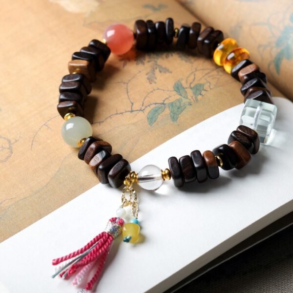 8mm Dalargan agarwood bracelet, gemstone accent mala, handmade spiritual jewelry, meditation prayer beads, elastic-free knotting design, ethical agarwood sourcing, bohemian tassel bracelet, natural aroma therapy, holistic wellness accessory, cultural symbolism jewelry, artisan crafted mala, grounding energy bracelet, versatile layering piece, eco-friendly materials, spiritual gift idea, luxury mindfulness jewelry, positive energy accessory, unique design bracelet, minimalist elegance, daily wear accessory.Temple consecration, house blessing, feng shui remedies, house pacification ceremonies, monk blessings, protective amulets, peace talismans, safety and peace assurance, wealth-invoking ceremonies, wealth deity statues, wealth-gathering formations, consecrated pi xiu (mythical creature), prayers and blessings, making vows, cultivating merit, peace and safety, imbuing objects with spiritual energy, infusing positive energy through sutra recitation, blessings, chanting mantras and dharani, liberation of deceased spirits, rebirth in the Pure Land, accumulating merit, nurturing compassion, devotional repentance, eliminating karmic obstacles, Buddha, Dharma, Sangha, portable guardian objects, peace-ensuring talismans, warding off evil spirits, neutralizing negative energies, averting disasters, deflecting misfortunes, Taiji and Bagua symbols. Buddhas: Dipamkara Buddha, Shakyamuni Buddha, Maitreya Buddha, Amitabha Buddha, Medicine Buddha, Akshobhya Buddha, Ratnasambhava Buddha, Amoghasiddhi Buddha, Five Dhyani Buddhas, Prabhutaratna Buddha. Bodhisattvas: Avalokiteshvara Bodhisattva, Manjushri Bodhisattva, Samantabhadra Bodhisattva, Ksitigarbha Bodhisattva, Mahasthamaprapta Bodhisattva, Guanyin, Wenshu, Puxian, Dizang, Maitreya, Akashagarbha, Vajrapani, Sarvanivarana-Vishkambhin.