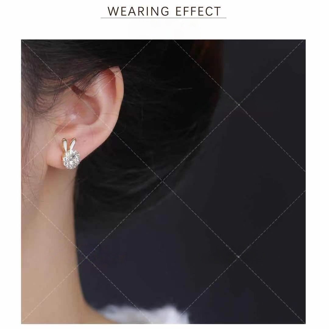 Lucky rabbit earrings, copper alloy jewelry, light luxury earrings, versatile fashion accessories, hypoallergenic earrings for women, symbolic animal earrings, minimalist elegant earrings, rhodium plated earrings, lightweight everyday earrings, gift for her, trendy animal motif, affordable luxury jewelry, sensitive ears safe, layered earring style, prosperity symbolism, fashion statement earrings, durable coated jewelry, office to evening wear, cultural symbolism earrings, rabbit-themed accessories.