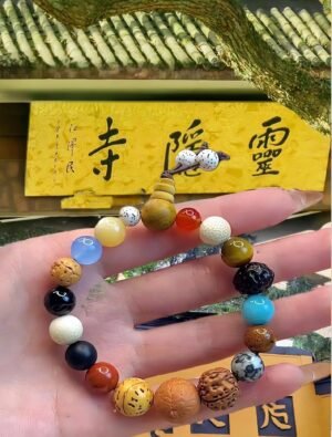Lingyin Temple blessed bracelet, 18-seed Buddhist mala, spiritual protection bracelet, natural seed prayer beads, good luck bracelet, Buddhist meditation accessories, eco-friendly spiritual jewelry, handmade mala bracelet, Zen lifestyle product, meaningful cultural gift, positive energy bracelet, ancient Buddhist tradition, sustainable jewelry, mindfulness practice tool, sacred Buddhist beads, adjustable prayer bracelet, Luckin Temple souvenir, spiritual grounding bracelet, unisex spiritual accessory, daily mindfulness bracelet.