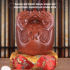 Handcrafted wooden fish with Buddhist symbols
