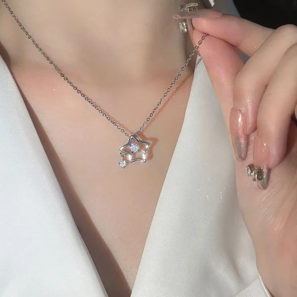 Titanium steel star necklace, five-point star pendant, light luxury women's jewelry, adjustable collarbone chain, cubic zirconia accents, JUSONG KLEIN brand, hypoallergenic necklace, silver electroplated jewelry, minimalist design necklace, versatile daily wear, elegant gift for her, sustainable materials, affordable luxury, artisan crafted, positive energy accessory, celestial inspired design, modern feminine style, special occasion gift, holistic wellness jewelry, niche fashion accessory.