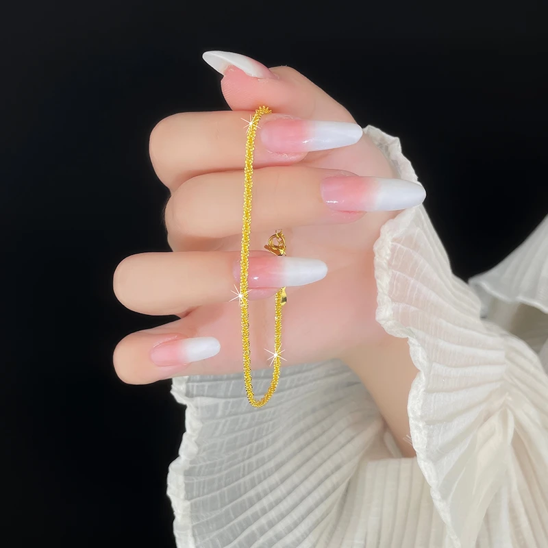 Sparkling wave copper alloy bracelet, gold-tone fragmented gold design, light luxury women's bracelet, adjustable chain bracelet, hypoallergenic jewelry, electroplated copper bracelet, minimalist gold bracelet, stackable bracelet, daily wear accessory, gift for her, sustainable materials, affordable luxury, artisan crafted, positive energy jewelry, modern minimalist style, cultural inspired design, holistic wellness accessory, special occasion gift, versatile jewelry, wave-inspired design.