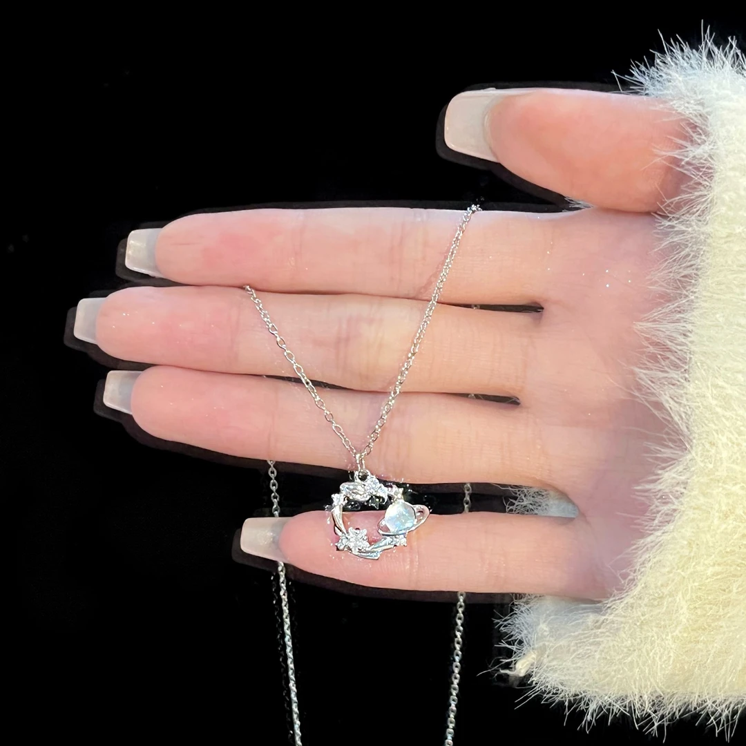 Titanium steel blue dream planet necklace, light luxury celestial pendant, adjustable collarbone chain, synthetic cubic zirconia jewelry, white gold finish necklace, women's fashion necklace, JUSONG KLEIN brand, hypoallergenic necklace, cosmic-themed accessory, gift for her, sustainable materials, affordable luxury, artisan crafted, versatile daily wear, elegant gift idea, modern minimalist style, positive energy jewelry, cultural inspired design, holistic wellness accessory, special occasion gift.