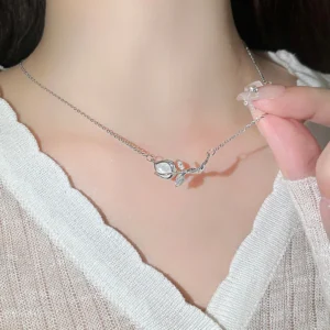 Titanium steel tulip necklace, women's floral collarbone chain, light luxury jewelry, sparkling accent pendant, hypoallergenic necklace, adjustable chain necklace, 2.5cm floral pendant, elegant gift for her, versatile daily necklace, nature-inspired jewelry, affordable luxury accessory, minimalist floral design, sustainable materials, bohemian chic style, holistic wellness accessory, cultural inspired design, artisan crafted, positive energy jewelry, unique niche jewelry, modern femininity.