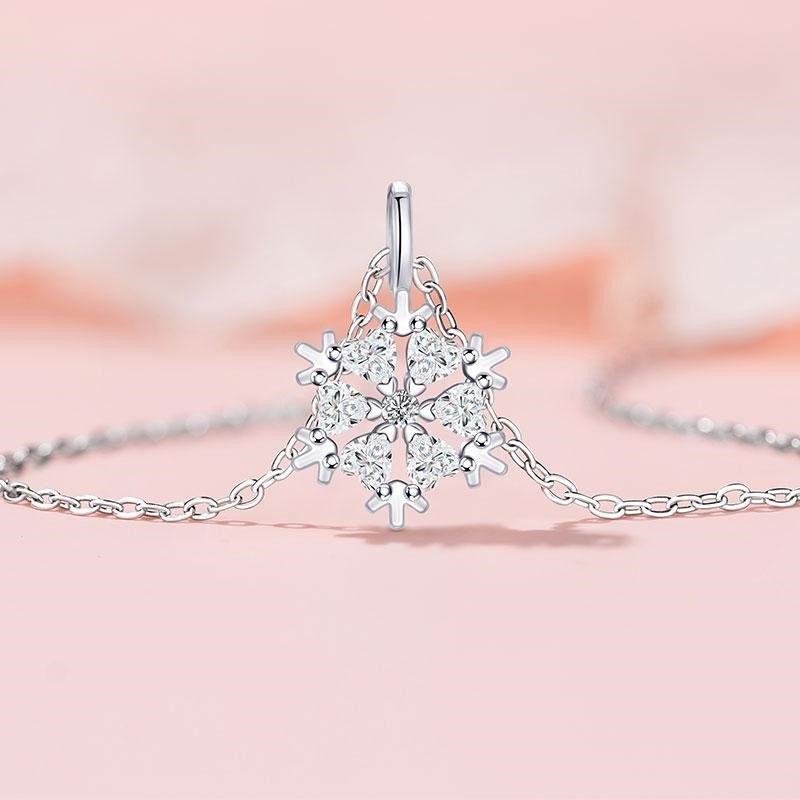 Winter snowflake necklace, titanium steel collarbone chain, cubic zirconia pendant, light luxury jewelry for women, hypoallergenic necklace, adjustable chain necklace, white gold electroplated jewelry, minimalist winter accessory, holiday gift idea, JUSONG KLEIN brand, sustainable fashion, artisan crafted, versatile daily wear, symbolic snowflake design, affordable luxury, elegant gift for her, modern minimalist style, seasonal jewelry, positive energy accessory, cultural inspired design.
