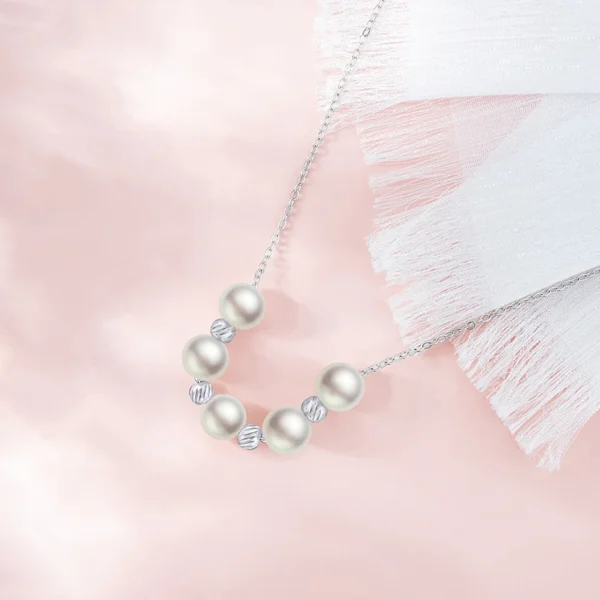 Titanium steel imitation pearl necklace, 5-pearl collarbone chain, light luxury jewelry for women, minimalist necklace with crystals, adjustable chain necklace, white gold-toned accessory, hypoallergenic fashion jewelry, niche design necklace, elegant everyday wear, sustainable materials, affordable luxury, crystal-accented pendant, versatile daily necklace, gift for her, modern minimalist style, artisan crafted, positive energy accessory, cultural inspired design, holistic wellness jewelry, timeless charm necklace.