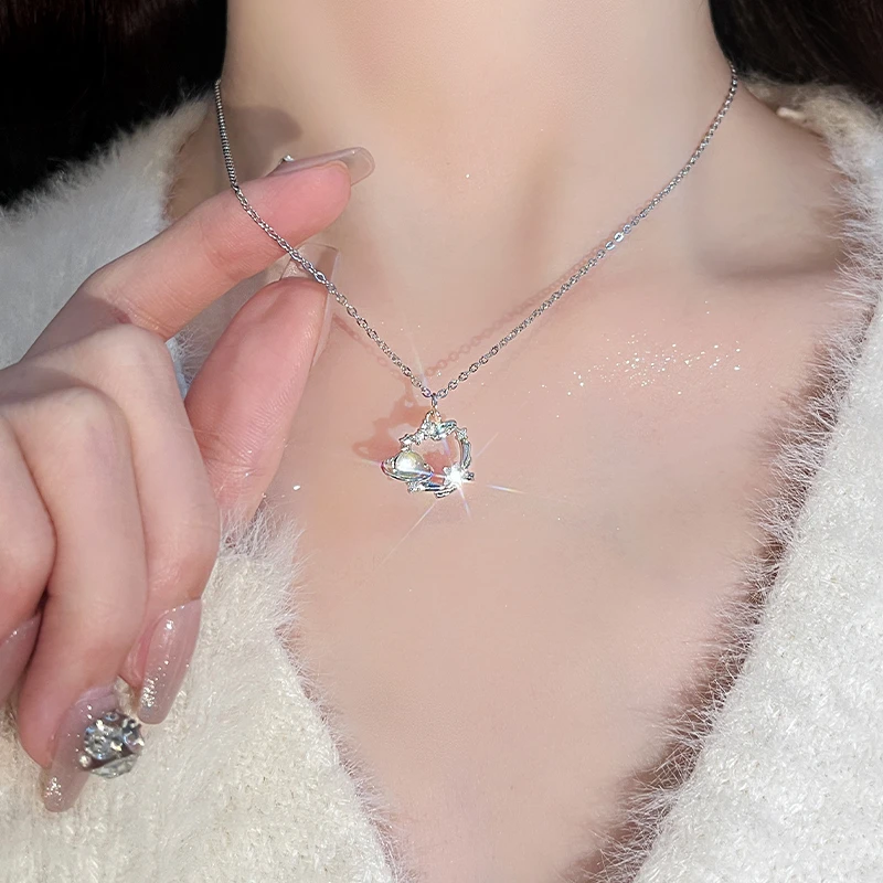 Titanium steel blue dream planet necklace, light luxury celestial pendant, adjustable collarbone chain, synthetic cubic zirconia jewelry, white gold finish necklace, women's fashion necklace, JUSONG KLEIN brand, hypoallergenic necklace, cosmic-themed accessory, gift for her, sustainable materials, affordable luxury, artisan crafted, versatile daily wear, elegant gift idea, modern minimalist style, positive energy jewelry, cultural inspired design, holistic wellness accessory, special occasion gift.