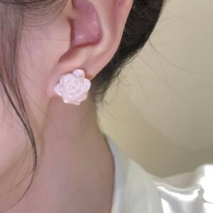 Glaze Blossom copper alloy earrings, rose-shaped floral studs, hypoallergenic light luxury jewelry, minimalist rose earrings for women, elegant everyday wear earrings, silver-toned floral design, romantic pink jewelry, niche artistic earrings, velvet gift box jewelry, affordable luxury accessories, nickel-free floral studs, tarnish-resistant copper alloy, delicate petal texture earrings, versatile daily wear, women's fashion gifts, sustainable materials, bohemian chic style, holistic wellness accessory, unique design earrings, cultural inspired elegance.
