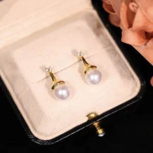 DUNZHU copper alloy earrings, light luxury pearl studs, vintage boho jewelry, hypoallergenic drop earrings, minimalist crystal accents, versatile women's accessories, gift box with rose, nickel-free earrings, tarnish-resistant design, affordable luxury jewelry, simulated pearl elegance, artistic niche earrings, daily wear elegance, sustainable materials, stacking earrings, romantic gift idea, gold-toned plating, sophisticated simplicity, holistic wellness accessory, cultural inspired design.