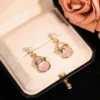 Ludeng copper-alloy earrings, light luxury pink stone earrings, teardrop design earrings, pearl accent jewelry, versatile fashion earrings, hypoallergenic gold-toned earrings, elegant daily wear earrings, gift for her, affordable luxury accessories, nickel-free earrings, tarnish-resistant jewelry, secure clutch earrings, feminine elegance earrings, nature-inspired accents, wardrobe staple earrings, sophisticated pearl details, casual to formal earrings, artistic jewelry design, modern classic earrings.