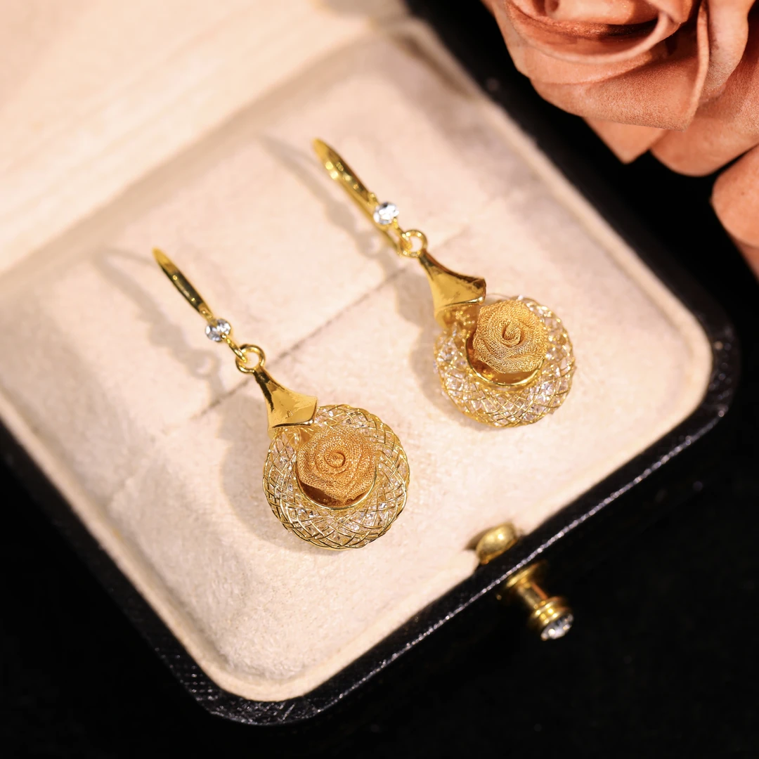 Yunguang copper-alloy earrings, rose pattern earrings, crystal-encrusted jewelry, light luxury fashion earrings, versatile gold-toned earrings, hypoallergenic romantic earrings, vintage-inspired accessories, gift for her, daily wear elegance, formal event jewelry, affordable luxury earrings, nickel-free earrings, tarnish-resistant design, secure clutch earrings, delicate rose motif, micro-crystal details, wardrobe staple earrings, sophisticated women's accessories, artistic design earrings, timeless elegance jewelry.