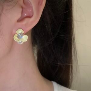 Copper-alloy floral earrings, Among the Blossoms earrings, light luxury jewelry, pearl accent earrings, versatile women's earrings, hypoallergenic earrings, gold-toned floral design, romantic earrings, elegant gift idea, fashion accessories, daily wear earrings, special occasion jewelry, affordable luxury, nickel-free earrings, tarnish-resistant jewelry, artistic design earrings, modern floral earrings, lightweight statement earrings, women's fashion gifts, blooming garden inspiration.