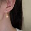 Ludeng copper-alloy earrings, light luxury pink stone earrings, teardrop design earrings, pearl accent jewelry, versatile fashion earrings, hypoallergenic gold-toned earrings, elegant daily wear earrings, gift for her, affordable luxury accessories, nickel-free earrings, tarnish-resistant jewelry, secure clutch earrings, feminine elegance earrings, nature-inspired accents, wardrobe staple earrings, sophisticated pearl details, casual to formal earrings, artistic jewelry design, modern classic earrings.