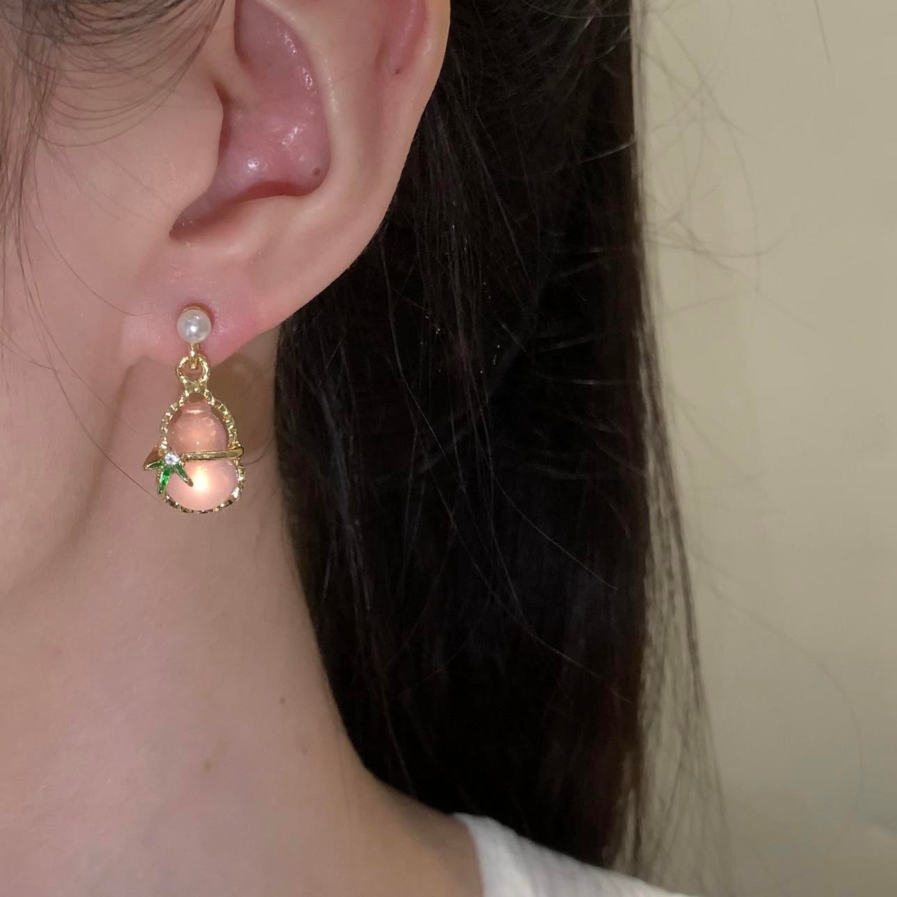 Ludeng copper-alloy earrings, light luxury pink stone earrings, teardrop design earrings, pearl accent jewelry, versatile fashion earrings, hypoallergenic gold-toned earrings, elegant daily wear earrings, gift for her, affordable luxury accessories, nickel-free earrings, tarnish-resistant jewelry, secure clutch earrings, feminine elegance earrings, nature-inspired accents, wardrobe staple earrings, sophisticated pearl details, casual to formal earrings, artistic jewelry design, modern classic earrings.